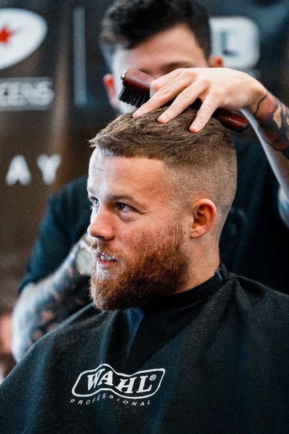 Wahl Barber cutting man's hair